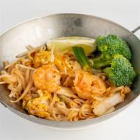 Pad Thai (Thai Style) · Choice of chicken Or shrimp, bean sprouts and egg with rice noodles, topped with crusted pea...