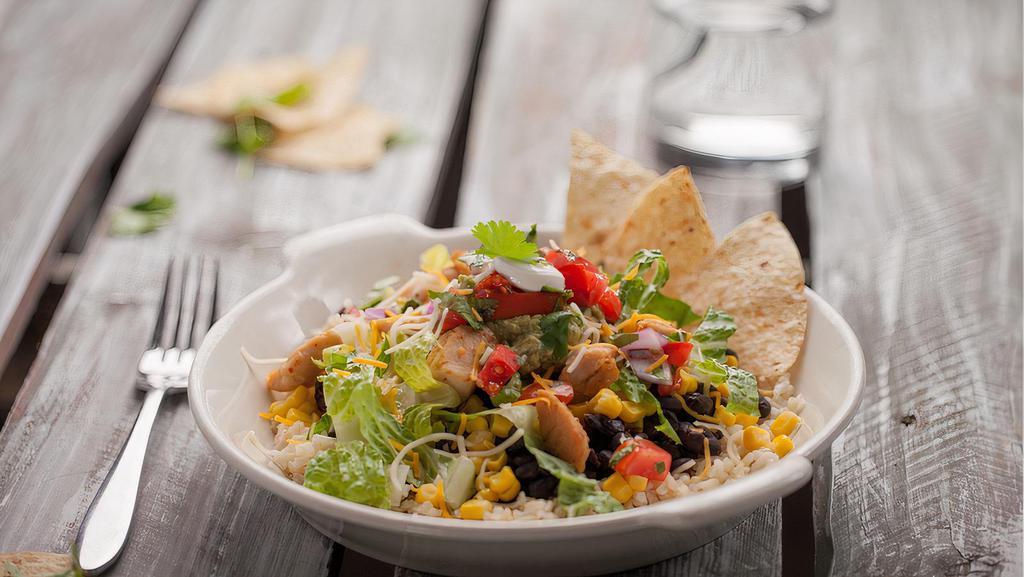 Southwest Salad · Iceberg, spring mix, tomato, onion, corn, black beans, avocado, chicken and Chipotle Southwest dressing.