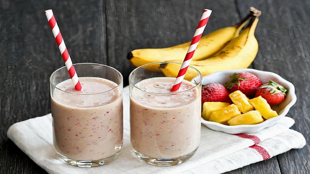 Tropical Pink Smoothie · Pineapples, strawberries, bananas & orange juice