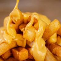  Cheese Fries · Our homemade crispy fries drizzled with yummy cheese sauce.
