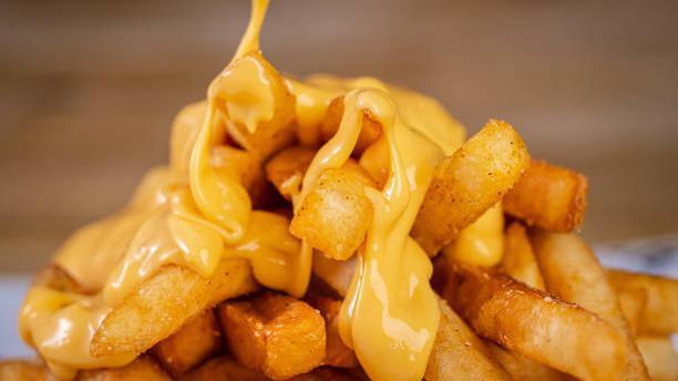  Cheese Fries · Our homemade crispy fries drizzled with yummy cheese sauce.