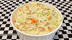 Coleslaw (12oz) · Aramex Coleslaw, shredded cabbage, carrots, fennel seeds, white venerate, mayo, and sugar.
