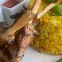 Khao Mok Lamb · Grilled Rack of Lamb.Comes with yellow curry spice Rice,asparagus, peanut sauce,lime sauce, ...