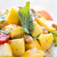 Mango Salad · Spicy. Fresh mango, cherry tomatoes, mint, onion, cashew nuts and crushed chili tossed with ...