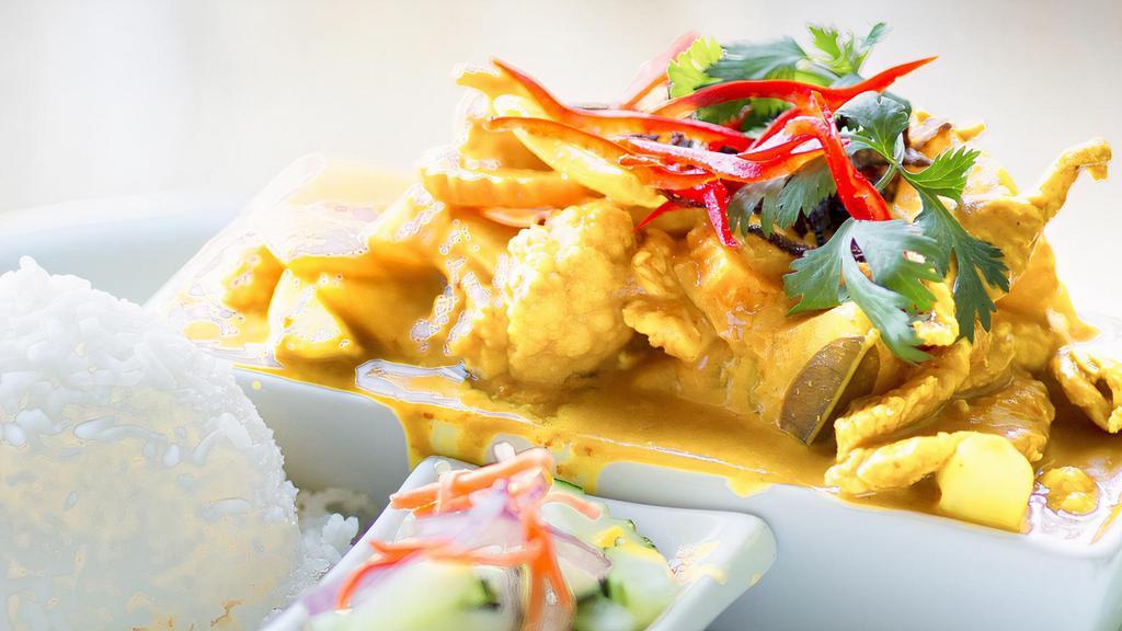 Yellow Curry · Spicy. Choice of chicken, beef, pork, prawns or seafood with potatoes, onion, cauliflowers, carrot and crispy shallot.