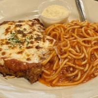 Veal Parmigiana · In the traditional style, with spaghetti and meat sauce served with soup or salad.