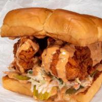 The Hot Chick · Nashville style fried chicken breast, secret sauce, dill pickle slices, lettuce.
