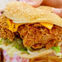 Spicy Fried Chicken Sandwich with Fries · Crispy battered chicken, lettuce, special sauce, and creamy cheese on a gourmet bakery bun s...