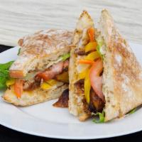 Jerk Chicken Sandwich · Grilled Spicy Jerk chicken served on toasted Ciabatta Bun with Jerk mayo, lettuce Tomato and...