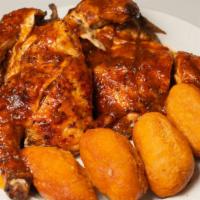 Whole Jerk Chicken with 4 Festival · Whole Jerk Chicken served with choice of Jerk sauce + 4 festival