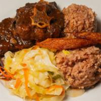 Braised Oxtail Meal · Slow cooked Braised Oxtail in savory brown sauce served with and peas, sautéed vegetables an...