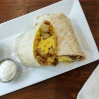 Breakfast Burrito · Scrambled eggs, jack, green onions, country potatoes, bacon, sautéed vegetables, or sausage.