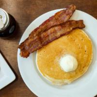Pancake Breakfast · Two buttermilk pancakes, two eggs, and bacon.