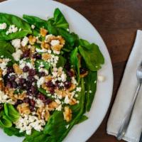 Spinach Salad · Feta, walnuts and craisins with balsamic dressing.