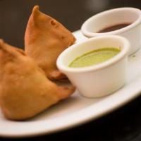 VEGETABLE SAMOSA · Deep fried flaky filed with potatoes, onions and Indian spices