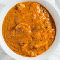BUTTER CHICKEN · Boneless chicken thigh marinated cooked in tandoori oven then cooked with onion, tomatoes al...