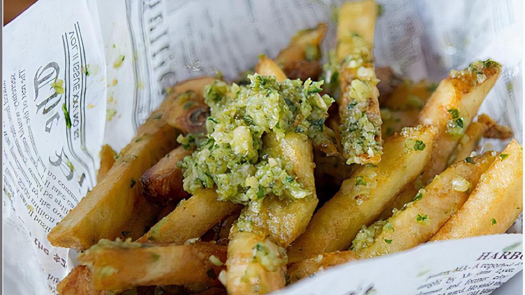 Garlic Fries · Thicker cut fries with garlic and parsley.