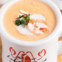 Lobster Bisque · Creamy lobster shell broth and lobster.