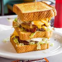 The Crypt · (TWO) 1/3 lb. burger patties stuffed between 3 slices of thick, grilled Texas toast, layered...