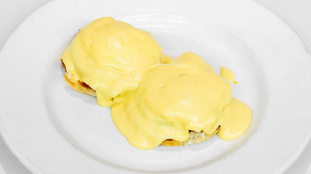 Eggs Benedict · Poached eggs and Canadian bacon on a toasted English muffin topped with hollandaise sauce.