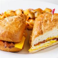 Jim's Breakfast Sandwich · Bacon, ham or sausage, 2 eggs and cheese on French roll.