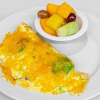 Avocado, Bacon and Cheese Omelet · Chunks of fresh avocado and chopped bacon mixed with cheddar cheese and made into a fluffy t...