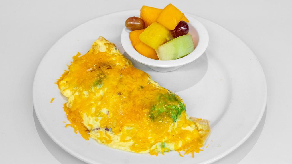 Avocado, Bacon and Cheese Omelet · Chunks of fresh avocado and chopped bacon mixed with cheddar cheese and made into a fluffy three-egg pan-fried omelet.
