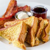 Special #3 · 4 halves thick French toast with choice of: 2 strips of bacon or 2 sausage links or 1 sausag...