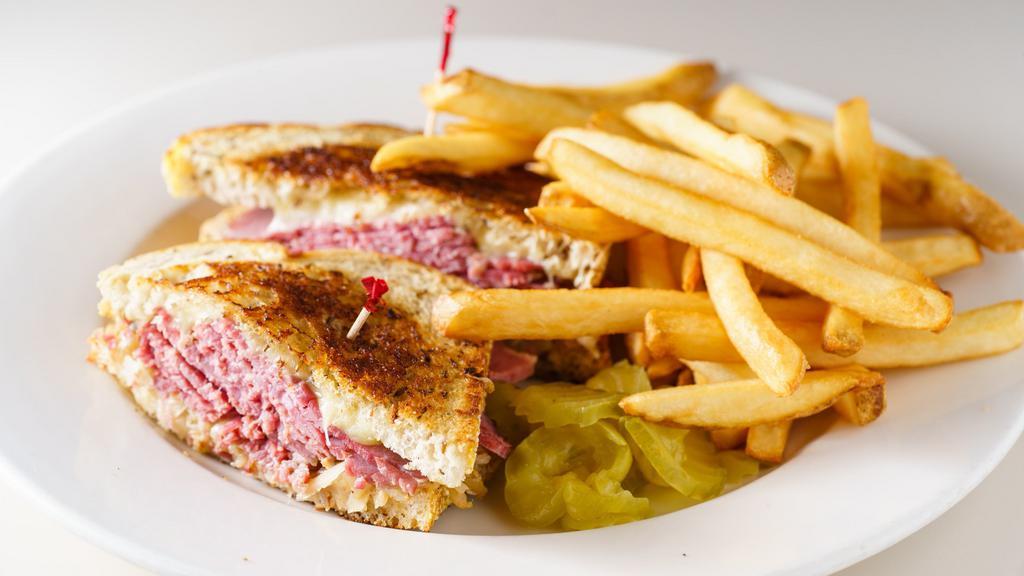 Reuben · Corned beef on rye with melted Swiss and sauerkraut.