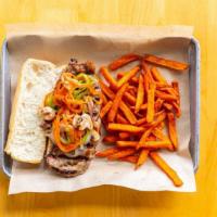New York Steak Sandwich · Grilled NY steak strip with sauteed onions and bell peppers on a sourdough sandwich roll.