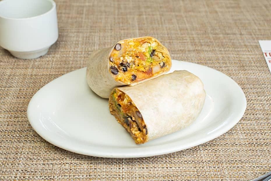 Baja Breakfast Burrito* · Eggs, breakfast potatoes, cheese, bacon, avocado, beans, and ranchero salsa