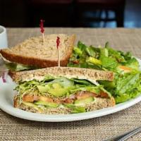 Veggie Delight* · Hummus, Persian cucumbers, avocado, lettuce, tomatoes, red onions, and sprouts