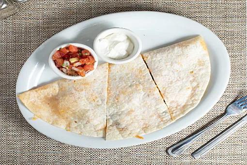 Quesadilla* · Grilled poblano peppers, fresh salsa, and sour cream