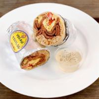 Silog Burrito · Your choice of vegan pork, chicken, tocino, or longanisa chorizo topped with adobo garlic ri...