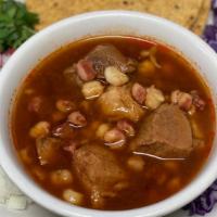Pozole · Pozole is a traditional Mexican stew that's made with hominy and pork and its garnished with...