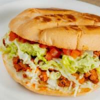 Torta · Mexican sandwich with choice of meat on a hot roll with mayonnaise, Monterey jack cheese, le...