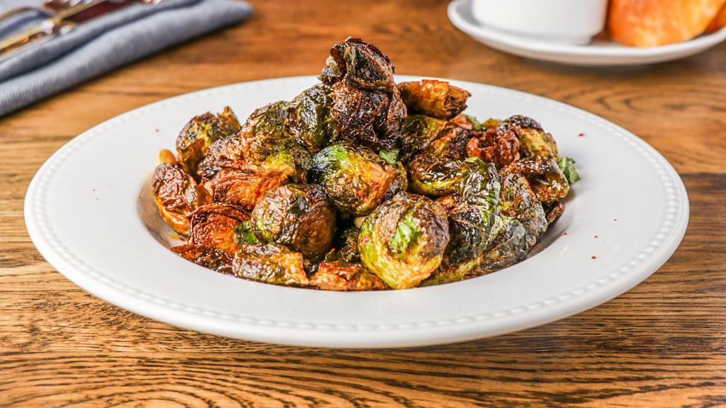 Brussels Sprouts · onion caramel, lime, mint,  garlic, almonds, aleppo.