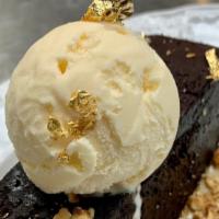 Gravity Bar · flourless chocolate brownie bar,
caramel, hazelnut praline,
vanilla bean ice cream
