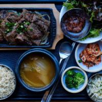 Galbi  · Soy marinated beef short ribs served with 3 types of banchan and choice of rice