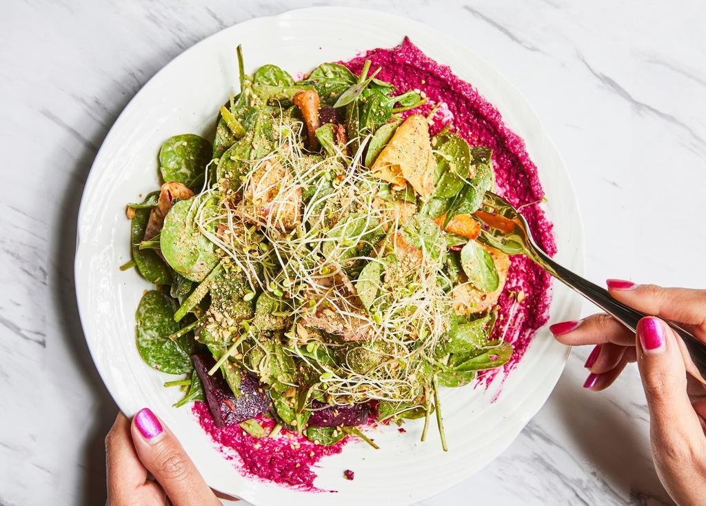 INDIE BOWL · tender baby spinach tossed with a tahini vinaigrette. served with roasted beets, taro chips, avocado, beet hummus, cashew dukkah, alfalfa sprouts. vegan & gluten free
