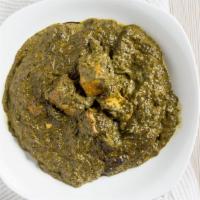 Saag Paneer · Fresh spinach cooked with herbs and spices with homemade cheese cubes.