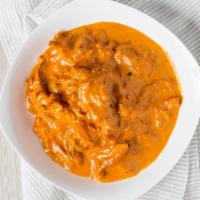 Butter Chicken · Boneless strips of tandoori chicken cooked in a mild creamy sauce