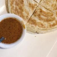Roti · Thai pancake served with house red curry dip.