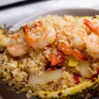 F1 - Pineapple Fried Rice · Pineapple, onion, cashews, carrots, and egg tossed with seasoned fried rice.