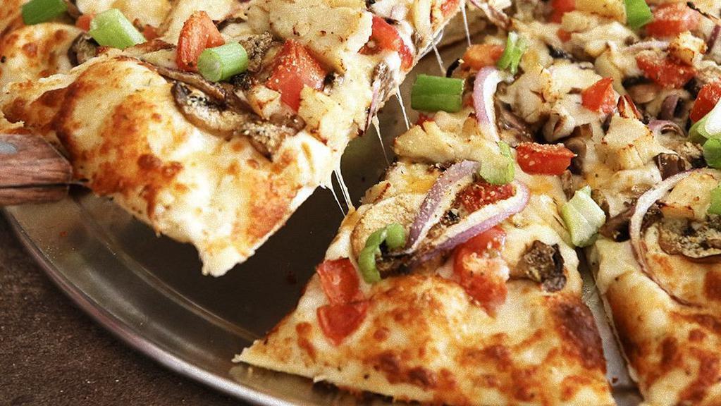 Chicken & Garlic Gourmet Pizza · Chicken, garlic, mushrooms, tomatoes, red and green onions, Italian herb seasoning on creamy garlic sauce.