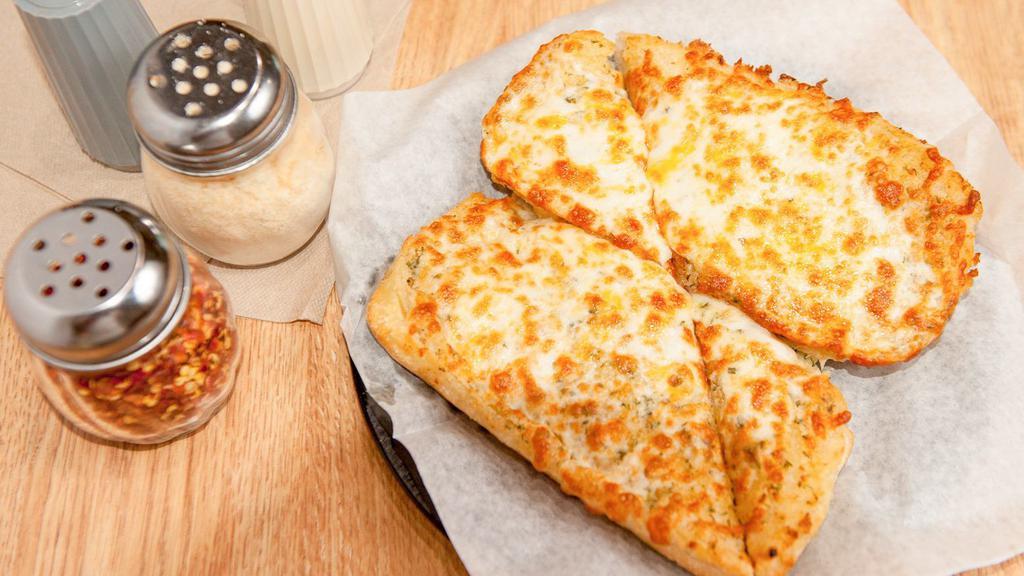 Garlic Bread With Cheese  · Our ciabatta bread baked with herbs, our own garlic spread and topped with mozzarella, provolone and cheddar cheese.