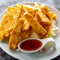 Yam fries · Sweet yam battered and crisply deep fried served with sweet & sour sauce.