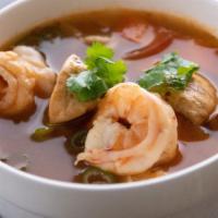 Tom Yum · Medium.Thai hot & sour and herbed broth with lemongrass, mushrooms, onions, carrots, tomato ...