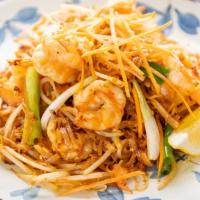 Pad Thai · Small rice noodles wok stir-fried with egg, beansprout and onions topped with shredded carro...