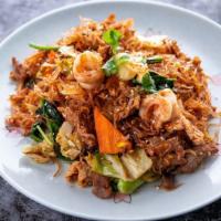 Thai Suki Dry Noodle · Mild.Combination of prawns, chicken, beef, tofu and glass noodles wok stir- fried in Thai re...